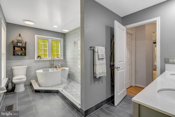 Bathroom, Dual Sink Vanities, Free Standing Baths, Interior, Recessed Lighting, Wood Texture Flooring