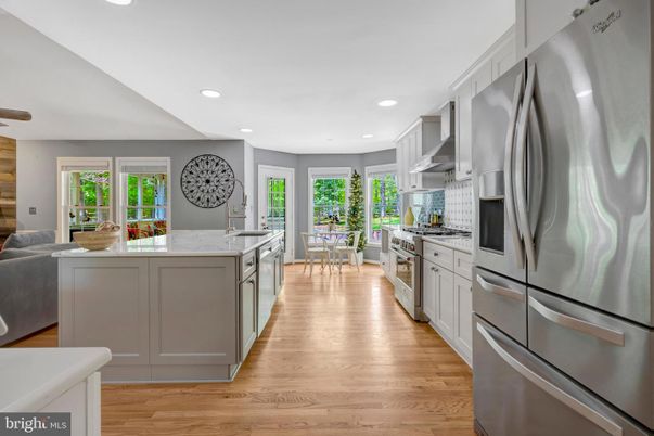 Dining room, Interior, Kitchen, Recessed Lighting, Stainless Steel Appliances, Wood Texture Flooring