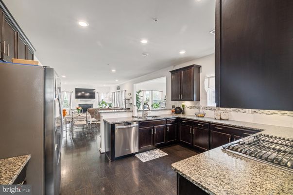 Dining room, Interior, Kitchen, Recessed Lighting, Stainless Steel Appliances, Wood Texture Flooring