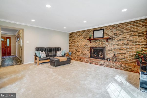 Fireplace, Interior, Living room, Recessed Lighting, Stone Walls, Wood Texture Flooring