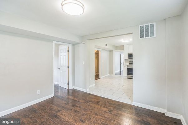 Empty room, Interior, Kitchen, Stainless Steel Appliances, Wood Texture Flooring