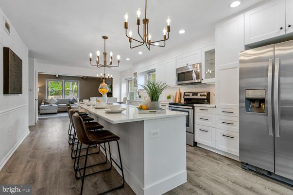 Chandelier, Interior, Kitchen, Living room, Pendant Lights, Recessed Lighting, Stainless Steel Appliances, Wood Texture Flooring