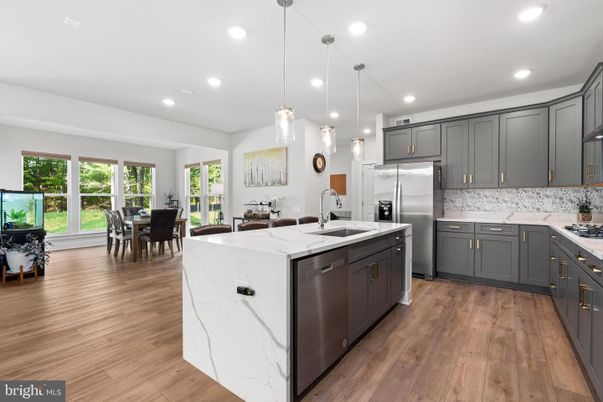 Dining room, Interior, Kitchen, Pendant Lights, Recessed Lighting, Stainless Steel Appliances, Wood Texture Flooring