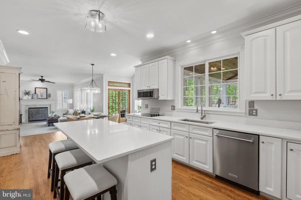 Dining room, Fireplace, Interior, Kitchen, Living room, Pendant Lights, Recessed Lighting, Stainless Steel Appliances, Wood Texture Flooring