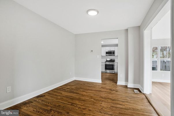 Empty room, Interior, Kitchen, Stainless Steel Appliances, Wood Texture Flooring