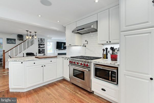 Chandelier, Interior, Kitchen, Recessed Lighting, Stainless Steel Appliances, Wood Texture Flooring