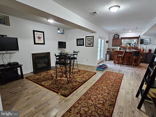 Dining room, Fireplace, Interior, Kitchen, Pendant Lights, Wood Texture Flooring
