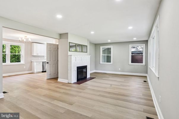 Chandelier, Empty room, Fireplace, Interior, Kitchen, Recessed Lighting, Wood Texture Flooring