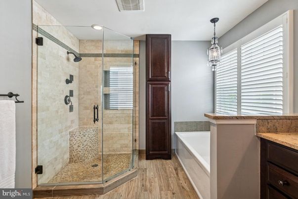 Bathroom, Chandelier, Glass Shower, Interior, Pendant Lights, Recessed Lighting, Wood Texture Flooring