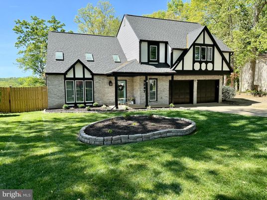 Attached, Backyard, Exterior, Facade, Brick Facade, Tudor Revival