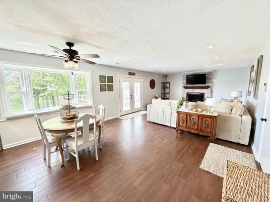 Dining room, Fireplace, Interior, Living room, Recessed Lighting, Wood Texture Flooring