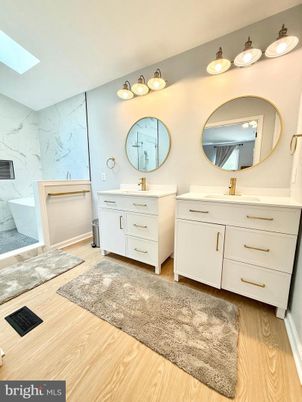 Bathroom, Dual Sink Vanities, Interior, Marble Walls, Wood Texture Flooring