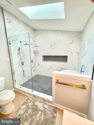 Bathroom, Glass Shower, Interior, Marble Walls, Wood Texture Flooring
