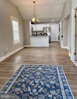 Chandelier, Interior, Kitchen, Pendant Lights, Recessed Lighting, Stainless Steel Appliances, Wood Texture Flooring