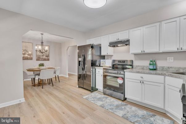 Chandelier, Dining room, Interior, Kitchen, Pendant Lights, Stainless Steel Appliances, Wood Texture Flooring