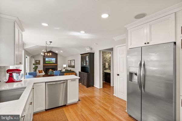 Dining room, Fireplace, Interior, Kitchen, Living room, Pendant Lights, Recessed Lighting, Stainless Steel Appliances, Wood Texture Flooring
