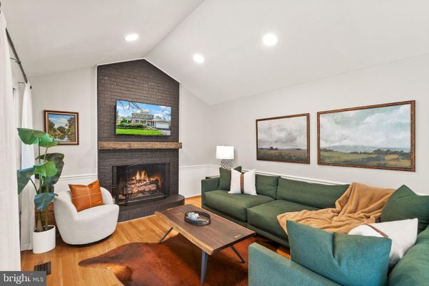 Fireplace, Interior, Living room, Recessed Lighting, Stone Walls, Wood Texture Flooring