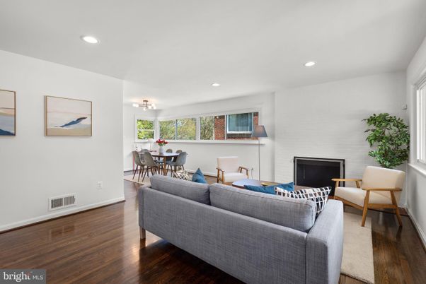 Dining room, Fireplace, Interior, Living room, Recessed Lighting, Wood Texture Flooring