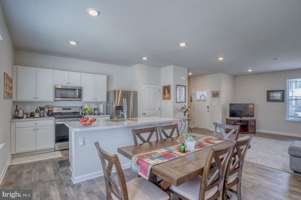 Dining room, Interior, Kitchen, Recessed Lighting, Stainless Steel Appliances, Wood Texture Flooring