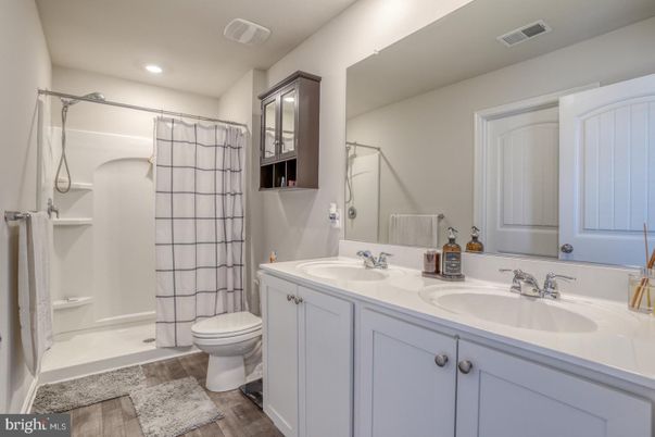 Bathroom, Dual Sink Vanities, Interior, Recessed Lighting, Wood Texture Flooring