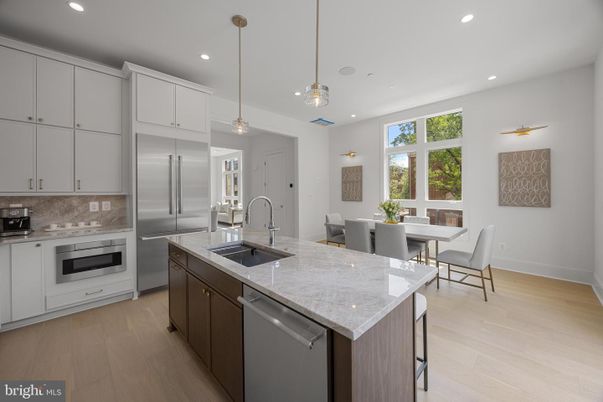 Dining room, Interior, Kitchen, Pendant Lights, Recessed Lighting, Stainless Steel Appliances, Wood Texture Flooring