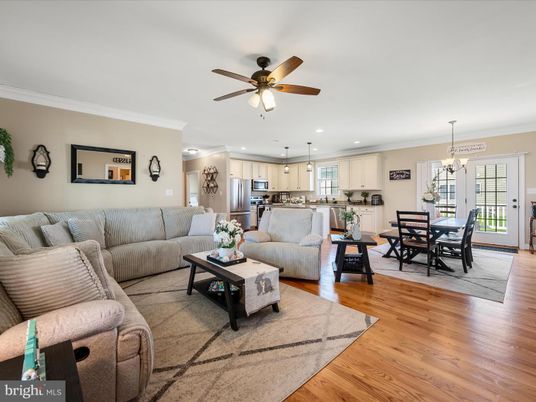 Chandelier, Dining room, Interior, Kitchen, Living room, Pendant Lights, Recessed Lighting, Stainless Steel Appliances, Wood Texture Flooring