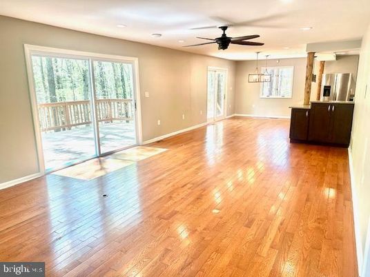 Empty room, Interior, Kitchen, Pendant Lights, Recessed Lighting, Stainless Steel Appliances, Wood Texture Flooring