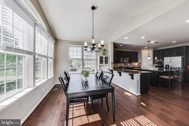 Chandelier, Dining room, Interior, Kitchen, Pendant Lights, Recessed Lighting, Stainless Steel Appliances, Wood Texture Flooring