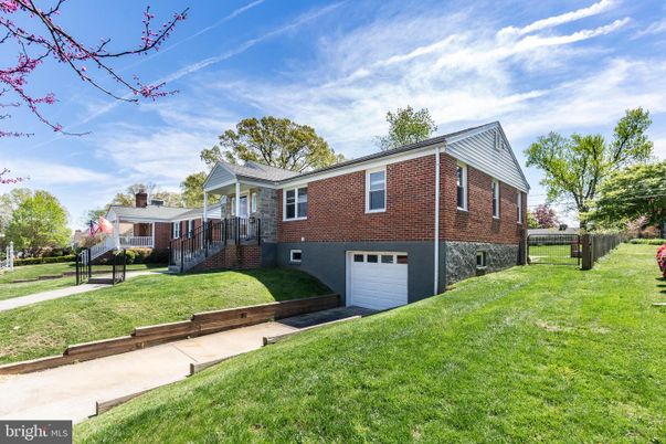 Attached, Backyard, Exterior, Facade, Brick Facade, Raised Ranch