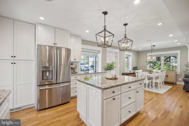 Chandelier, Dining room, Interior, Kitchen, Pendant Lights, Recessed Lighting, Stainless Steel Appliances, Wood Texture Flooring