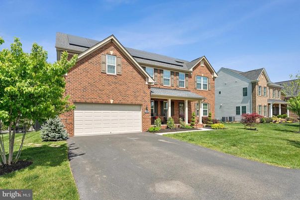 Attached, Exterior, Facade, Brick Facade, Solar Panels, Brick Traditional