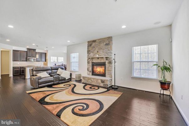 Fireplace, Interior, Kitchen, Living room, Recessed Lighting, Stainless Steel Appliances, Stone Walls, Wood Texture Flooring