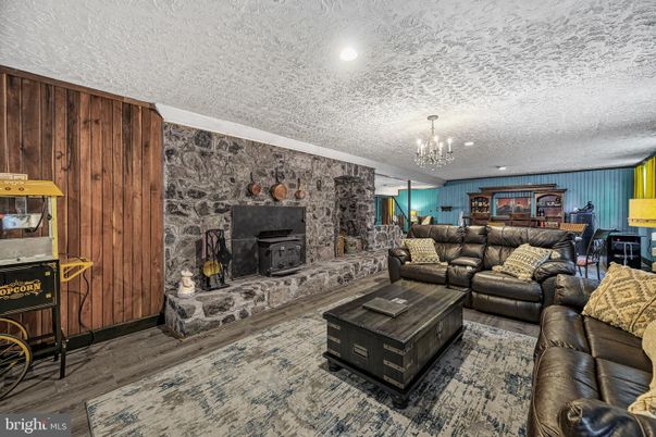 Chandelier, Fireplace, Interior, Living room, Recessed Lighting, Stone Walls