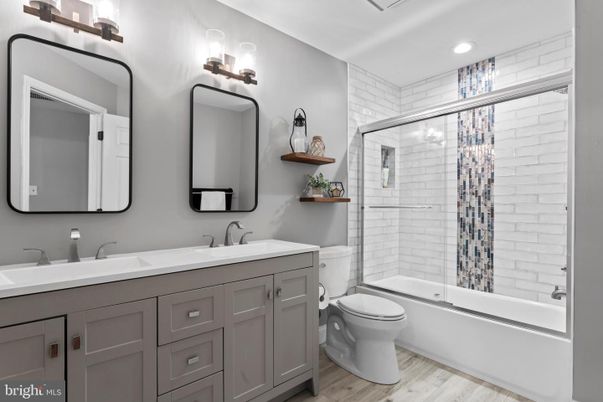 Bathroom, Dual Sink Vanities, Glass Shower, Interior, Recessed Lighting, Wood Texture Flooring