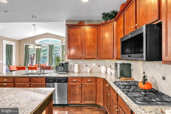 Chandelier, Dining room, Interior, Kitchen, Recessed Lighting, Stainless Steel Appliances, Wood Texture Flooring