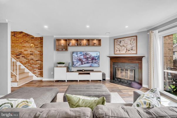 Fireplace, Interior, Living room, Recessed Lighting, Stone Walls, Wood Texture Flooring