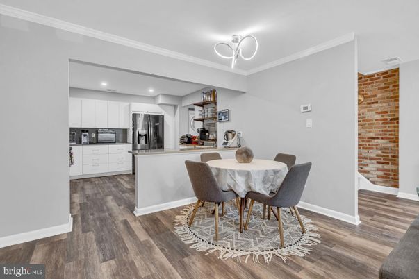 Dining room, Interior, Kitchen, Recessed Lighting, Stainless Steel Appliances, Stone Walls, Wood Texture Flooring