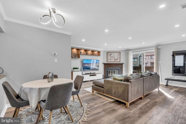 Dining room, Fireplace, Interior, Living room, Recessed Lighting, Wood Texture Flooring