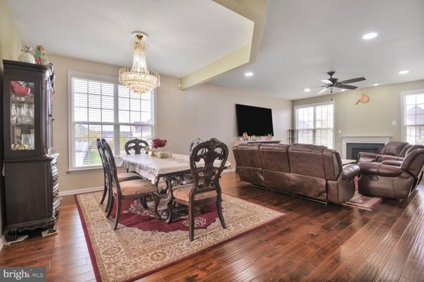 Chandelier, Dining room, Fireplace, Interior, Living room, Recessed Lighting, Wood Texture Flooring