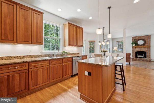 Dining room, Fireplace, Interior, Kitchen, Pendant Lights, Recessed Lighting, Stainless Steel Appliances, Wood Texture Flooring