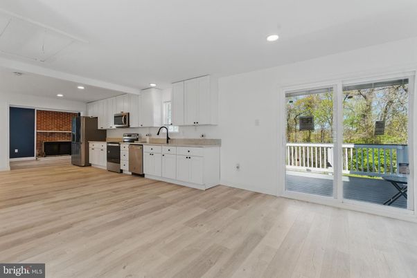 Fireplace, Interior, Kitchen, Recessed Lighting, Stainless Steel Appliances, Wood Texture Flooring