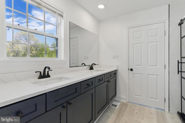 Bathroom, Dual Sink Vanities, Interior, Recessed Lighting, Wood Texture Flooring