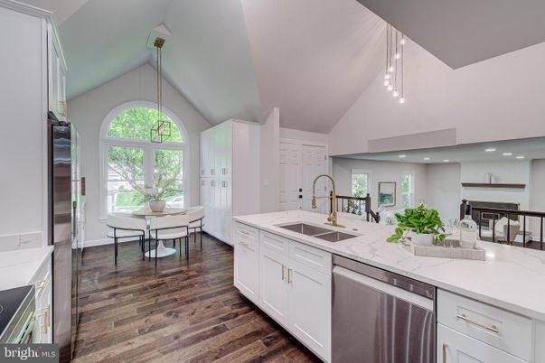 Dining room, Interior, Kitchen, Pendant Lights, Recessed Lighting, Stainless Steel Appliances, Wood Texture Flooring