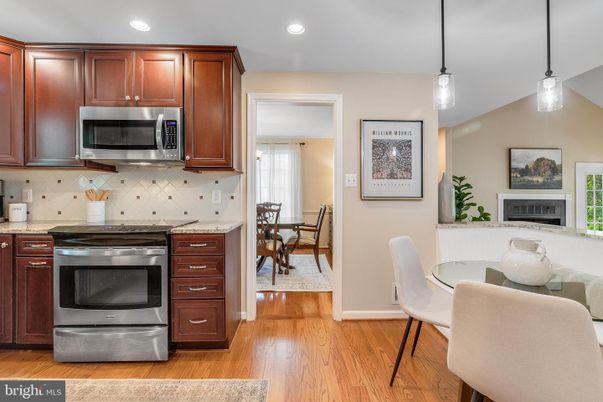 Dining room, Fireplace, Interior, Kitchen, Pendant Lights, Recessed Lighting, Stainless Steel Appliances, Wood Texture Flooring