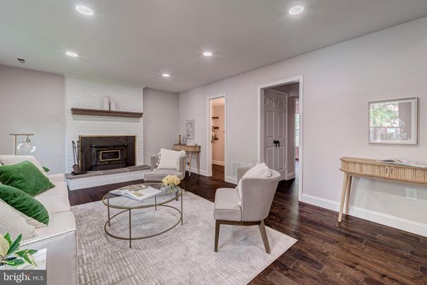 Fireplace, Interior, Living room, Recessed Lighting, Stone Walls, Wood Texture Flooring