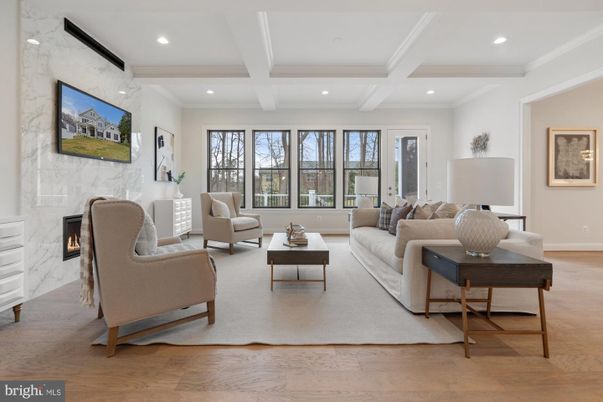 Fireplace, Interior, Living room, Marble Walls, Recessed Lighting, Wood Texture Flooring