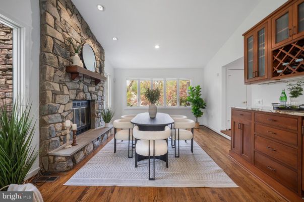Dining room, Fireplace, Interior, Recessed Lighting, Stone Walls, Wood Texture Flooring