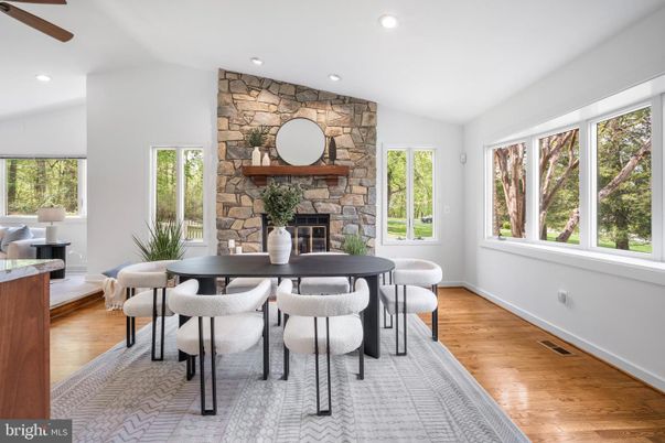 Dining room, Fireplace, Interior, Recessed Lighting, Stone Walls, Wood Texture Flooring