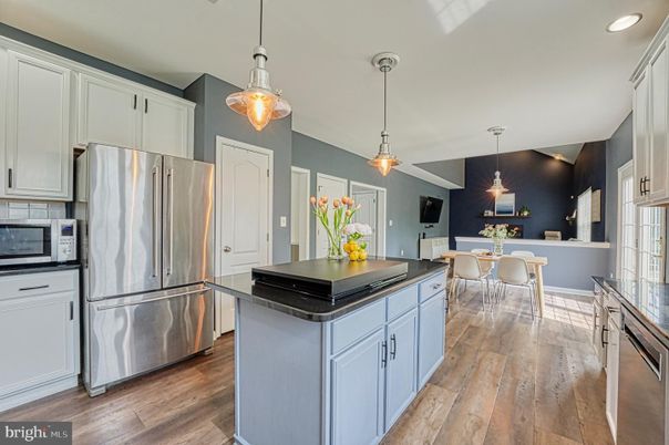 Dining room, Interior, Kitchen, Pendant Lights, Recessed Lighting, Stainless Steel Appliances, Wood Texture Flooring