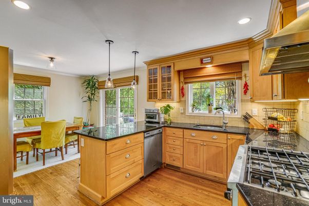 Dining room, Interior, Kitchen, Pendant Lights, Recessed Lighting, Stainless Steel Appliances, Wood Texture Flooring